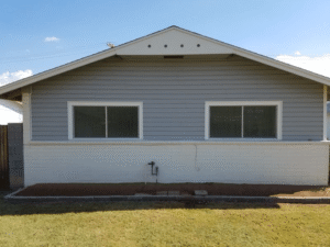 Concrete Repairman LLC technician inspecting foundation cracks and structural damage on a residential home to provide expert repair solutions. Call 480-725-7614 today to schedule your professional foundation evaluation and receive trusted repair services. Concrete Repairman LLC offers reliable, durable foundation repairs tailored for Arizona homes.