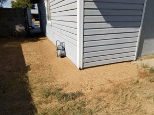 Concrete Repairman LLC technician performing foundation inspection and repair on a residential property to address cracks and structural issues. Call 480-725-7614 today to schedule your professional foundation evaluation and get trusted repair services. Concrete Repairman LLC offers reliable and durable foundation repair solutions tailored for Arizona homes.