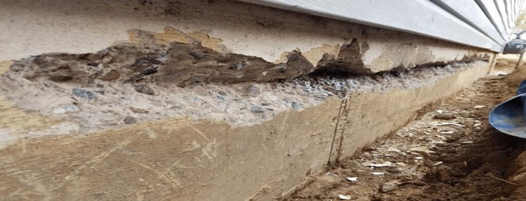 Foundation damage with visible cracks and settlement issues being inspected and repaired by Concrete Repairman LLC to restore structural stability. Call 480-725-7614 today to schedule a professional foundation evaluation and get expert repair services. Concrete Repairman LLC offers trusted, long-lasting foundation damage repair solutions for Arizona homes.