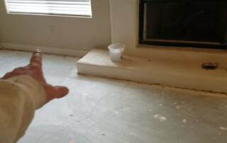 Image of a foundation repair contractor from Concrete Repairman LLC inspecting a residential home in Tempe, Arizona for structural damage. Call 480-725-7614 today to schedule a certified foundation inspection and get expert repair solutions. Concrete Repairman LLC is your trusted partner for professional foundation repairs in Tempe.