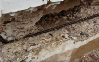 Image of a certified Concrete Repairman LLC technician using precision tools to perform engineered foundation repair on a residential property. Call 480-725-7614 today to schedule a structural inspection and receive expert repair solutions backed by engineering standards. Concrete Repairman LLC delivers trusted, science-based foundation repair across Arizona.