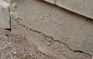 Image of a Concrete Repairman LLC technician restoring a crumbling stem wall on a Tempe, Arizona home. Call 480-725-7614 now to schedule an expert inspection and stop foundation damage with proven stem wall repair from Concrete Repairman LLC.