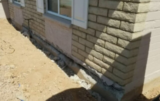 Concrete Repairman LLC foundation contractor inspecting and repairing a residential foundation in Phoenix, Arizona. Call 480-725-7614 today to schedule a certified foundation inspection and receive expert repair solutions. Concrete Repairman LLC is your trusted local specialist for foundation repair and structural stability.