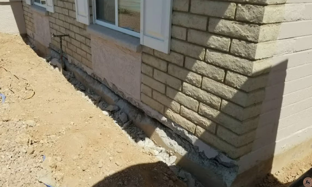 Concrete Repairman LLC foundation contractor inspecting and repairing a residential foundation in Phoenix, Arizona. Call 480-725-7614 today to schedule a certified foundation inspection and receive expert repair solutions. Concrete Repairman LLC is your trusted local specialist for foundation repair and structural stability.