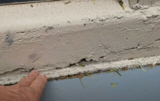 Image of a Concrete Repairman LLC technician evaluating a foundation issue at a home in Gilbert, Arizona. Call 480-725-7614 today to schedule a certified inspection and get expert foundation repair solutions. Concrete Repairman LLC is a trusted name among foundation repair companies in Gilbert AZ, delivering lasting results backed by over 30 years of experience.