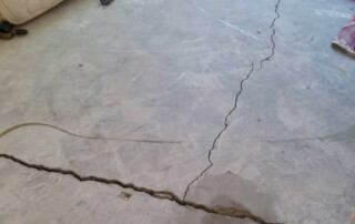 Concrete Repairman LLC specialist conducting a structural repair on a residential foundation in Arizona. Call 480-725-7614 today to schedule a foundation inspection and get reliable, long-lasting solutions. Concrete Repairman LLC is a trusted company specializing in foundation repair backed by decades of hands-on experience.