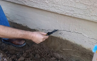 Concrete Repairman LLC technician repairing a home foundation in Chandler, Arizona using proven structural techniques. Call 480-725-7614 today to schedule a professional foundation inspection and protect your home from long-term damage. Concrete Repairman LLC is your trusted choice for expert home foundation repair in Chandler and surrounding areas.
