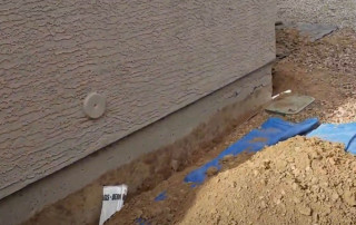 Image of a Concrete Repairman LLC specialist repairing a damaged stem wall on a residential foundation in Tempe, Arizona. Call 480-725-7614 now to schedule a professional inspection and prevent structural damage. Concrete Repairman LLC provides expert foundation and stem wall repair you can trust.